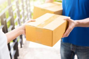 Man delivery two boxes to a person